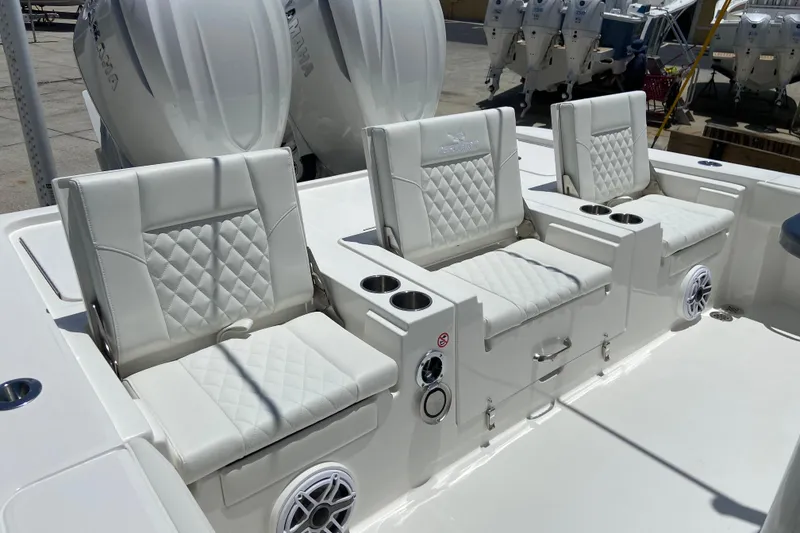 Slide: The Image of Luxurious seating on 2027 Regulator 30XO boat with cup holders and speakers. - 9