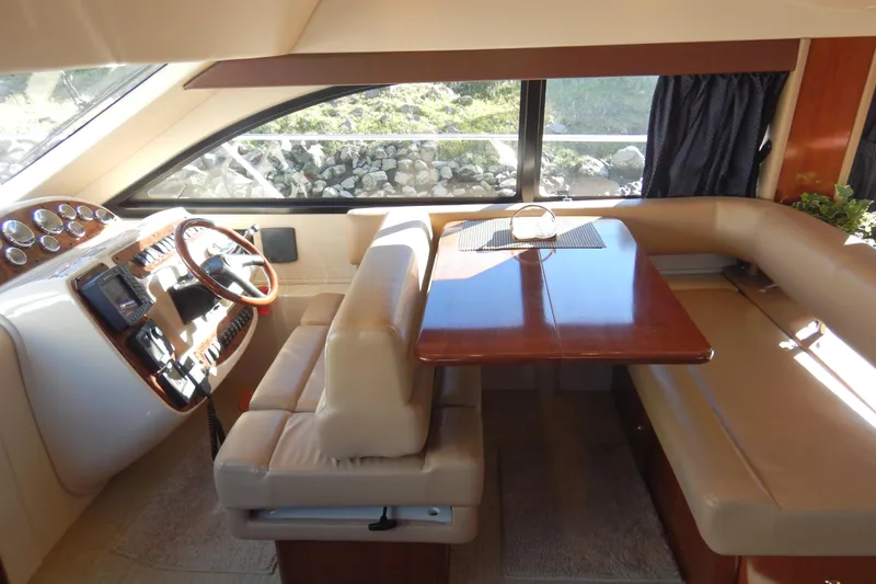 Slide: The Image of Interior of 2008 Meridian 411 Sedan yacht with dining area and helm station. - 17