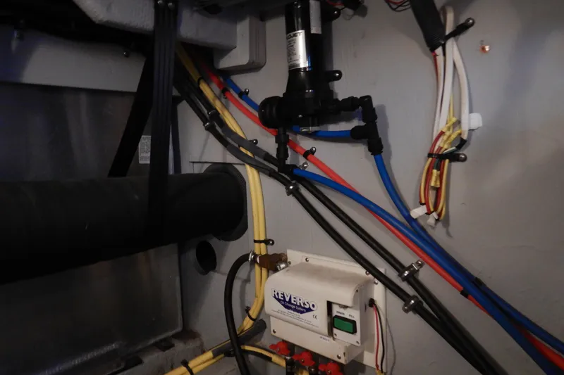 Slide: The Image of Engine room wiring and plumbing in a 2008 Meridian 411 Sedan boat. - 55