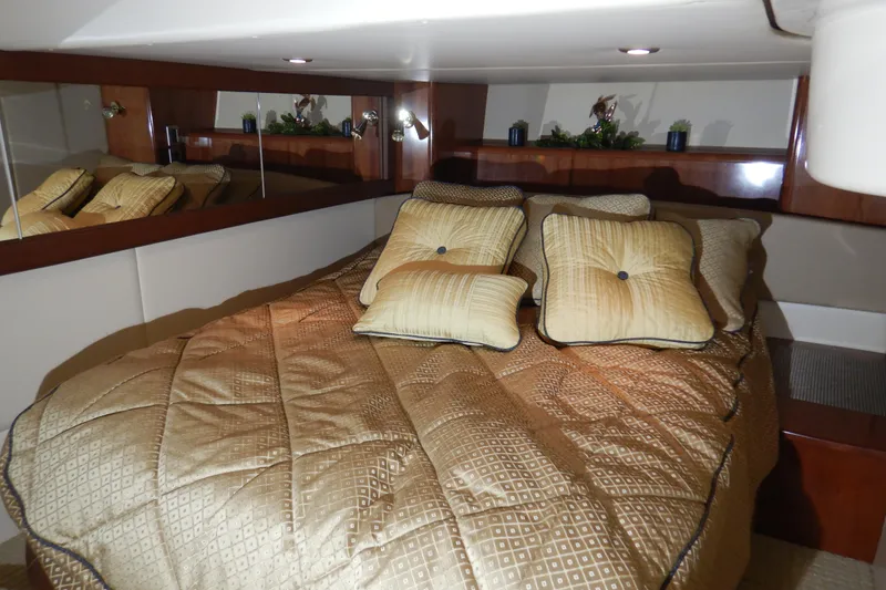 Slide: The Image of Luxurious bedroom interior of 2008 Meridian 411 Sedan yacht with plush bedding and cushions. - 34