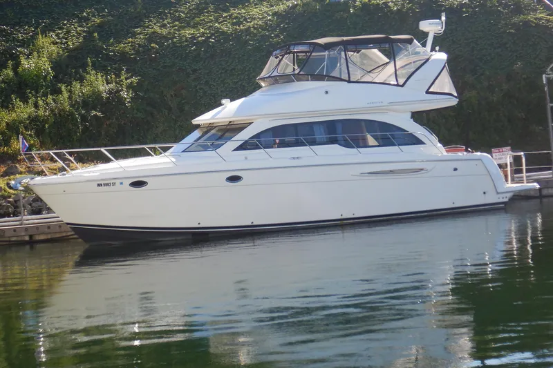 Slide: The Image of 2008 Meridian 411 Sedan yacht docked on calm water. - 1