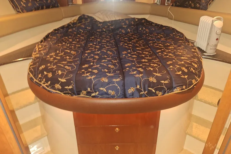 Slide: The Image of Luxurious cabin interior of a 2008 Meridian 411 Sedan yacht with elegant bedding. - 30