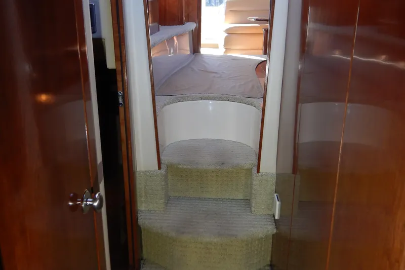 Slide: The Image of Interior view of 2008 Meridian 411 Sedan yacht with carpeted stairs and wooden paneling. - 27