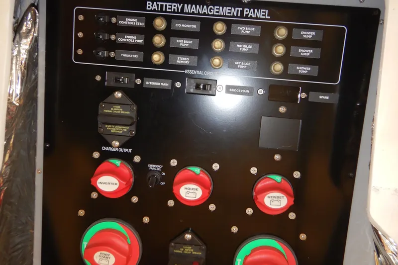Slide: The Image of Battery management panel on a 2008 Meridian 411 Sedan yacht, featuring various control switches. - 44
