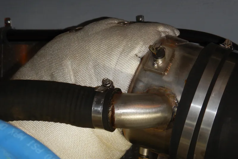 Slide: The Image of Gloved hand inspecting engine component on 2008 Meridian 411 Sedan. - 48