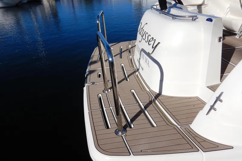 Slide: The Image of 2008 Meridian 411 Sedan yacht stern with swim platform and stainless steel railings. - 6