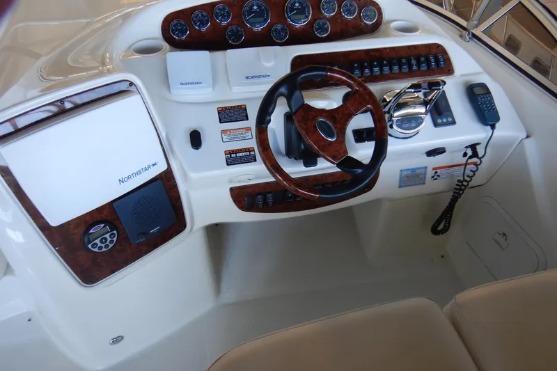 Slide: The Image of Helm of 2008 Meridian 411 Sedan with wood accents and navigation controls. - 40