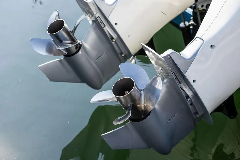 Slide: The Image of Twin propellers of a 2022 Hinckley 35 boat in water, showcasing sleek design. - 10