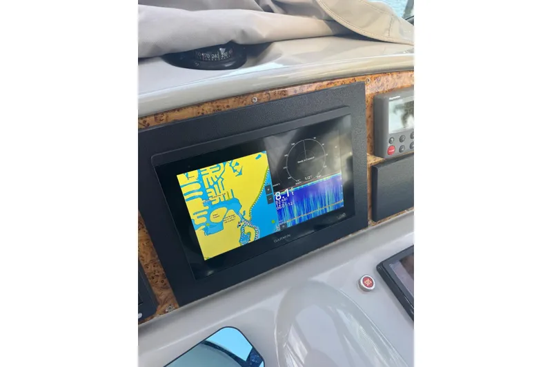 Slide: The Image of Dashboard of a 2008 Formula 37 Performance Cruiser with navigation display. - 14