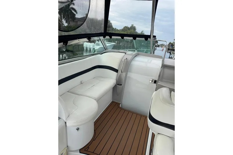 Slide: The Image of 2008 Formula 37 Performance Cruiser interior with white seating and wood-style flooring. - 17