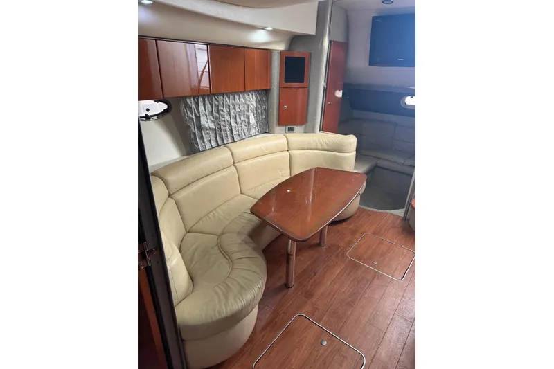 Slide: The Image of Interior of 2008 Formula 37 Performance Cruiser with beige seating and wooden table. - 21