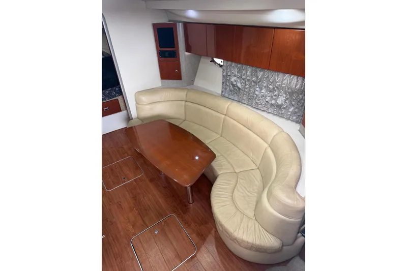 Slide: The Image of Interior of 2008 Formula 37 Performance Cruiser with curved leather seating and wooden table. - 22
