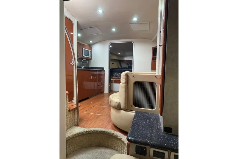 Slide: The Image of Interior of a 2008 Formula 37 Performance Cruiser with modern kitchen and seating area. - 30