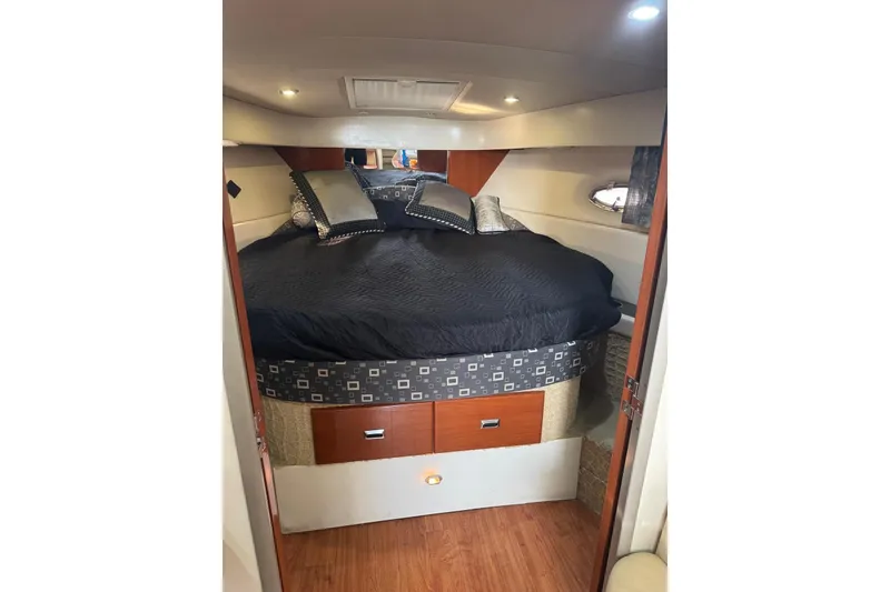 Slide: The Image of Interior cabin of a 2008 Formula 37 Performance Cruiser with a cozy bed setup. - 36