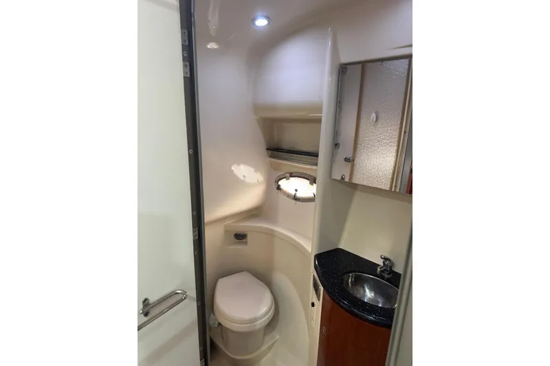 Slide: The Image of 2008 Formula 37 Performance Cruiser bathroom with toilet, sink, and compact design. - 39
