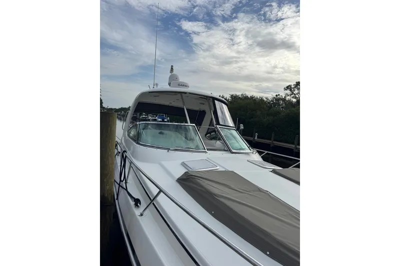 Slide: The Image of 2008 Formula 37 Performance Cruiser docked, featuring sleek design and Garmin equipment. - 40