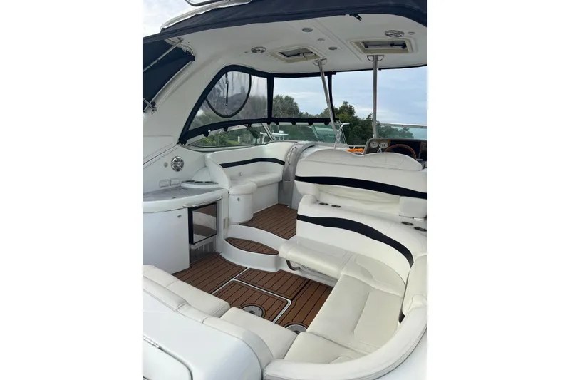 Slide: The Image of 2008 Formula 37 Performance Cruiser interior with white seating and wood flooring. - 43