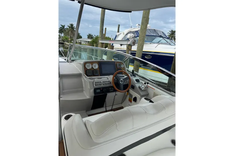 Slide: The Image of 2008 Formula 37 Performance Cruiser cockpit with steering wheel and control panel. - 47