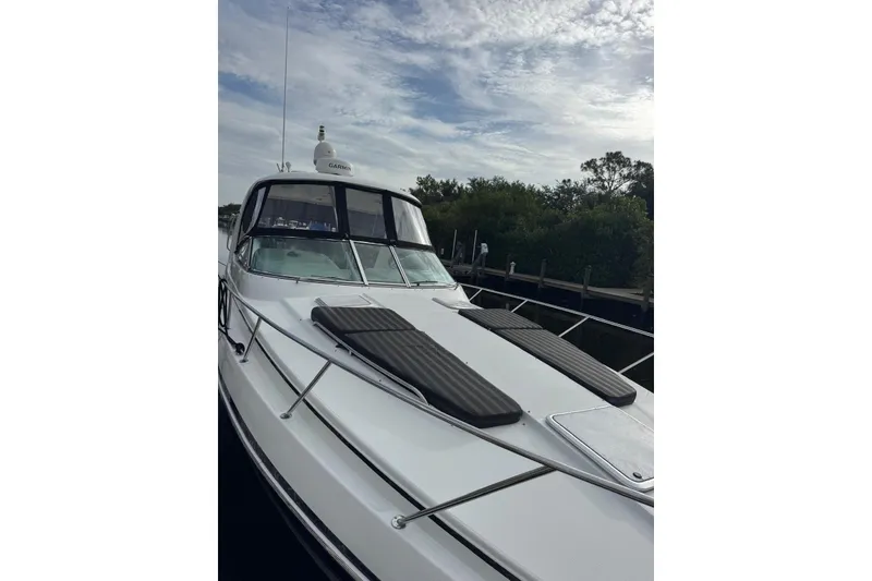 Slide: The Image of 2008 Formula 37 Performance Cruiser docked under a cloudy sky. - 48