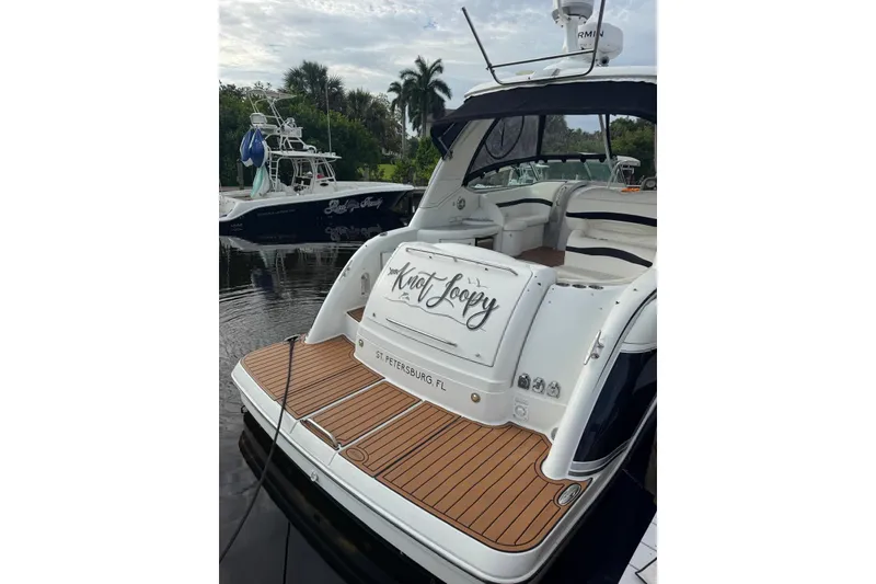 Slide: The Image of 2008 Formula 37 Performance Cruiser docked, featuring teak deck and elegant interior. - 49