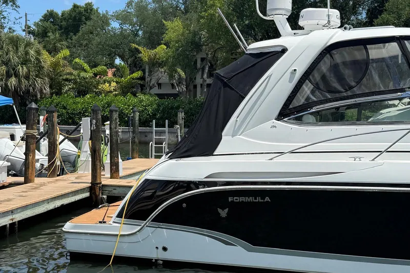 Slide: The Image of 2008 Formula 37 Performance Cruiser docked, featuring sleek design and modern amenities. - 5