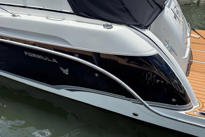 Slide: The Image of 2008 Formula 37 Performance Cruiser docked, showcasing sleek design and elegant detailing. - 9