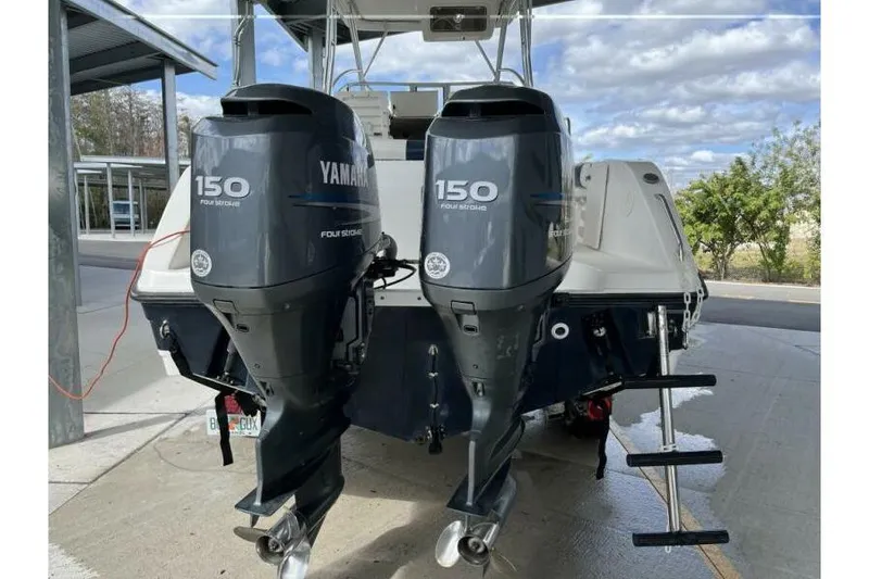 Slide: The Image of 2006 Century 2400 Walk-Around boat with twin Yamaha 150 four-stroke engines. - 4