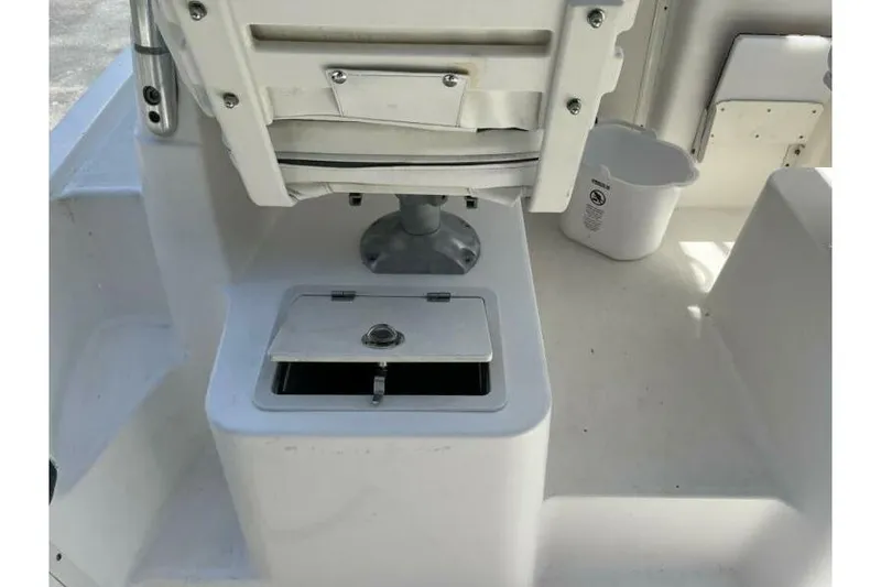 Slide: The Image of 2006 Century 2400 Walk-Around boat interior with storage compartment and seating. - 7