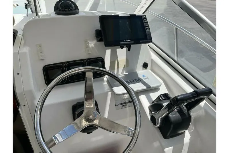 Slide: The Image of Helm of 2006 Century 2400 Walk-Around boat with Garmin navigation system. - 9