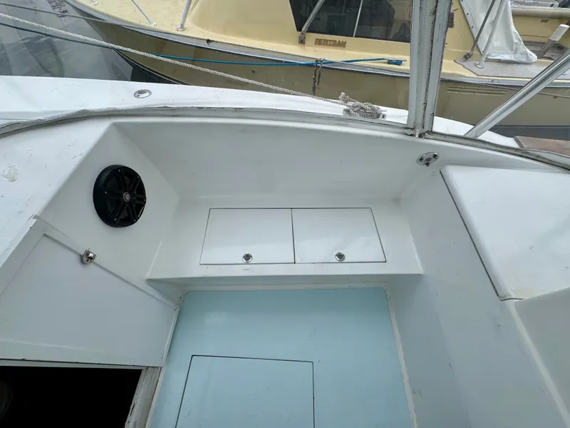 Slide: The Image of The image shows a boat cockpit with white seating areas and a speaker. - 19