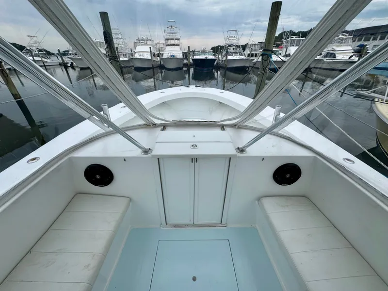 Slide: The Image of The boat is a 1992 L&H 33, docked in a marina with other boats. - 22