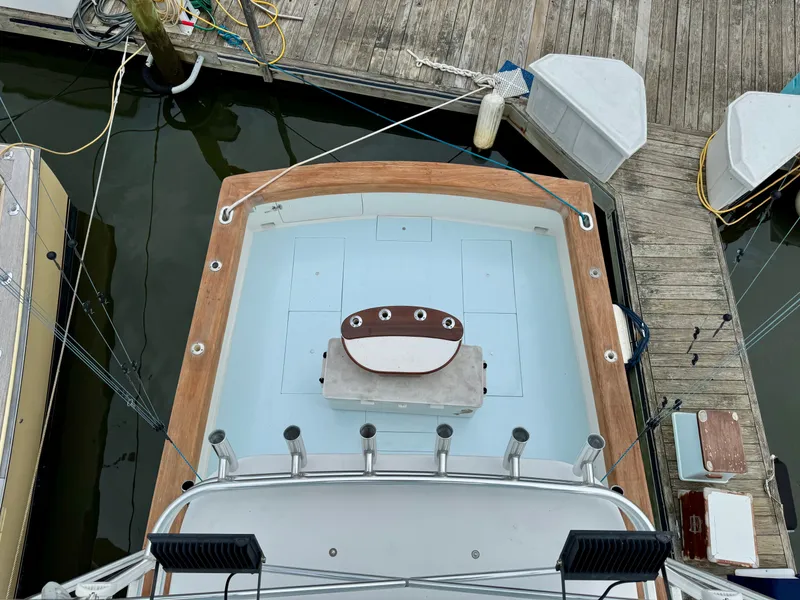Slide: The Image of Overhead view of a 1992 L&H 33 boat docked at a marina. - 8