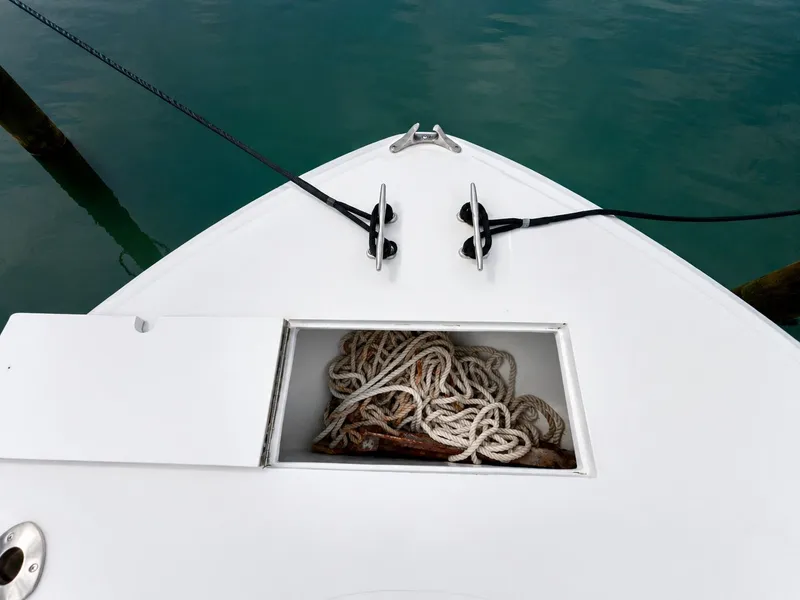 Slide: The Image of The image shows the bow of a boat with ropes stored in a compartment. - 13