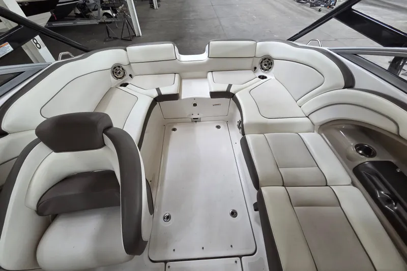 Slide: The Image of Interior of a 2013 Yamaha 242 Limited S boat with spacious seating. - 15