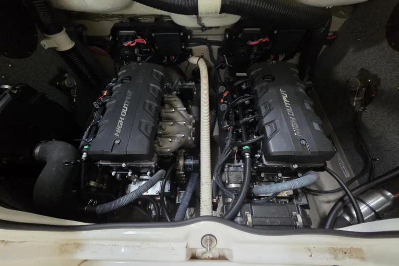 Slide: The Image of Engine compartment of a 2013 Yamaha 242 Limited S boat, featuring dual high-output engines. - 19