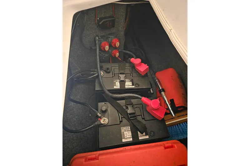 Slide: The Image of Battery compartment of a 2013 Yamaha 242 Limited S boat with wiring and safety equipment. - 20