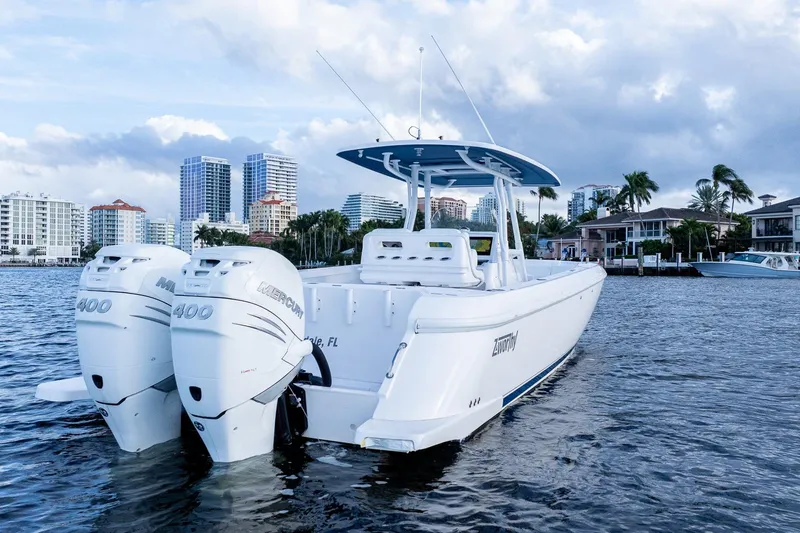 Slide: The Image of 2021 Intrepid boat with twin Mercury 400 engines on a coastal waterway. - 7