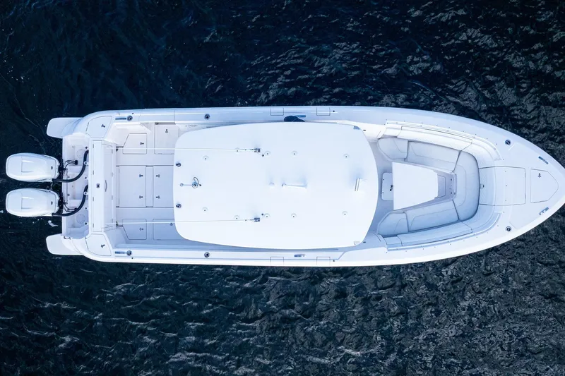 Slide: The Image of Aerial view of a 2021 Intrepid boat with dual engines on dark water. - 8