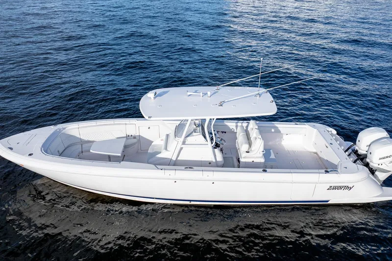 Slide: The Image of 2021 Intrepid boat on open water, featuring sleek design and powerful engines. - 5
