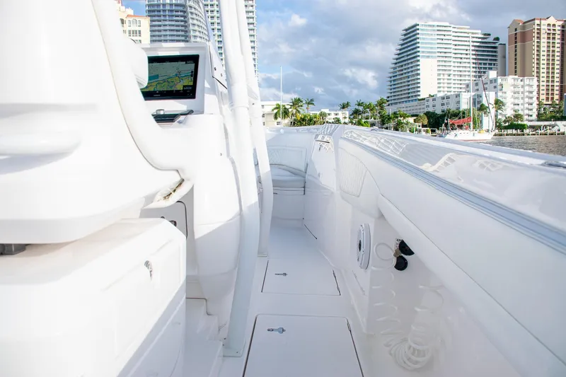 Slide: The Image of 2021 Intrepid boat interior with navigation screen, docked near modern cityscape. - 30