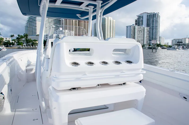 Slide: The Image of 2021 Intrepid boat interior with modern seating, city skyline in the background. - 23