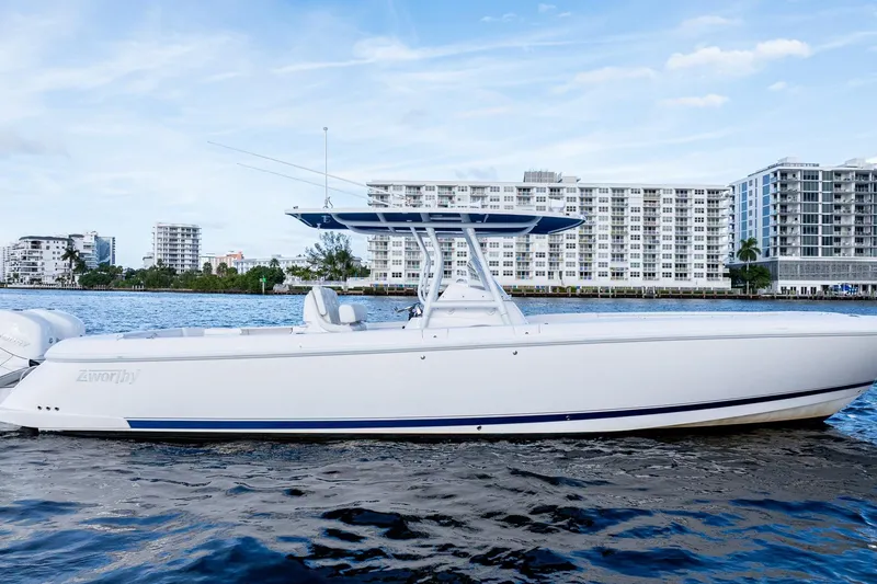 Slide: The Image of 2021 Intrepid boat on water with cityscape background, featuring sleek design and modern architecture. - 2