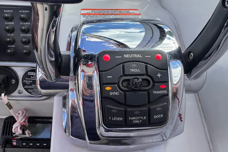 Slide: The Image of Control panel of a 2008 Crownline 320 LS boat with throttle and navigation buttons. - 11
