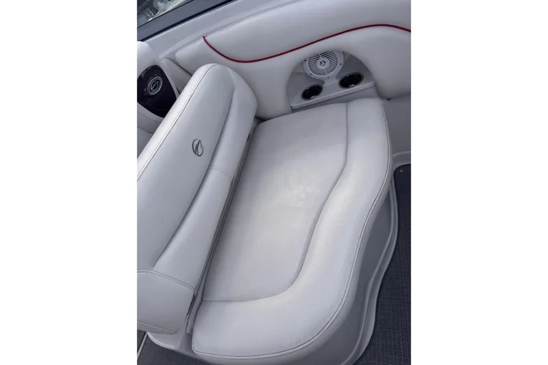 Slide: The Image of 2008 Crownline 320 LS boat interior with white leather seating and speaker system. - 12