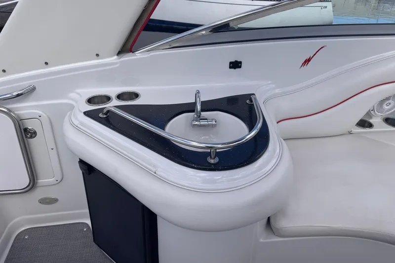 Slide: The Image of 2008 Crownline 320 LS boat interior with sink and seating area. - 13