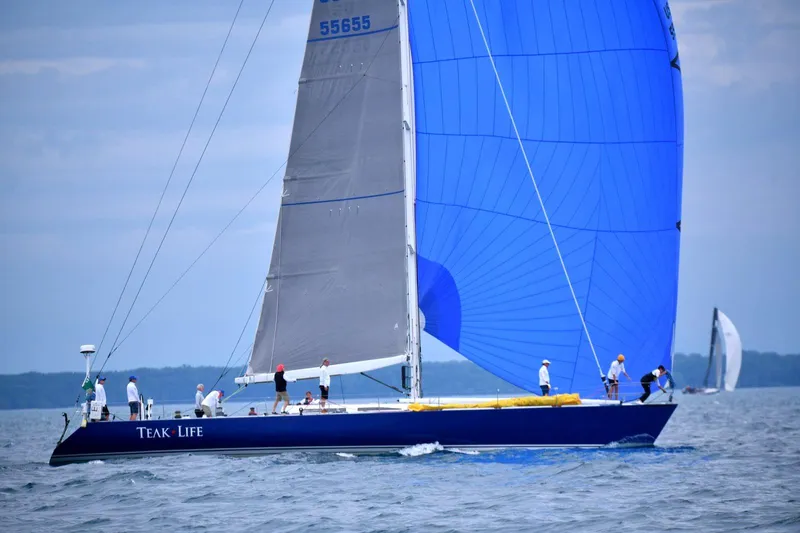 The Image of Sailboat Andrews 68 (1991) with blue spinnaker sailing on open water. - 0