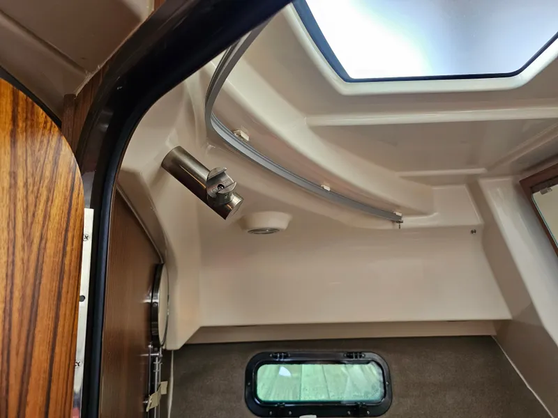 Slide: The Image of Interior of a 2025 Ranger Tugs R-27 with skylight and window. - 23