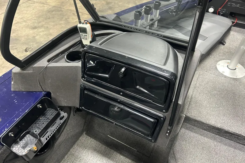 Slide: The Image of 2024 Tracker Targa V-18 Combo boat interior with dashboard and seating area. - 18