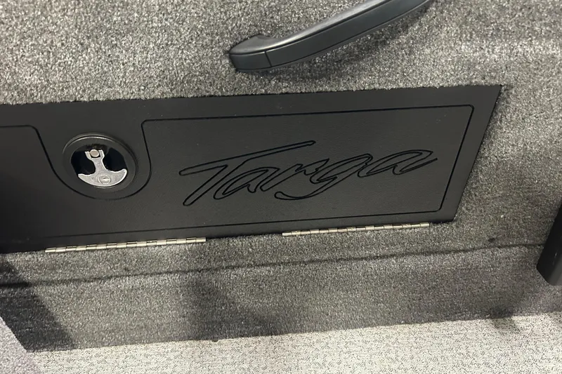 Slide: The Image of 2024 Tracker Targa V-18 Combo interior detail with logo and textured surface. - 19