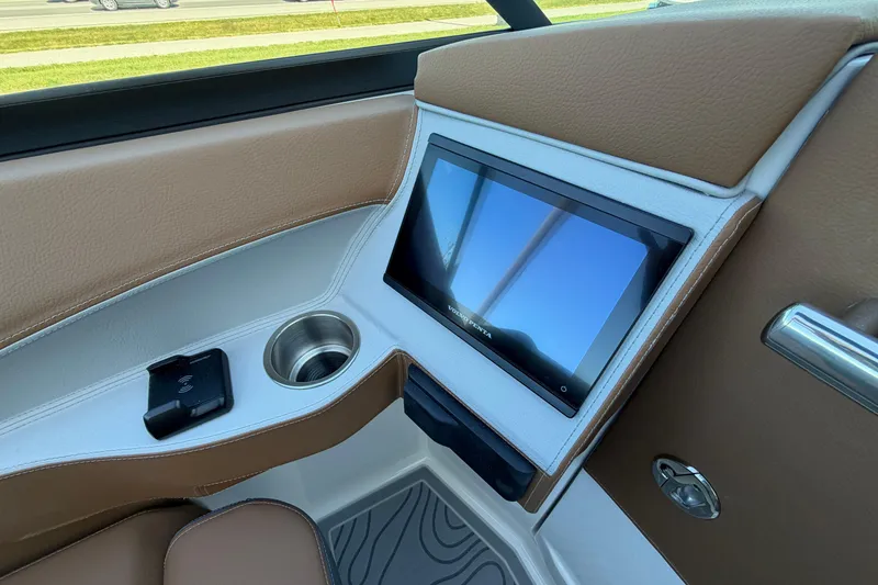 Slide: The Image of Interior of 2027 Regal LS6 featuring touchscreen display and cup holder. - 14